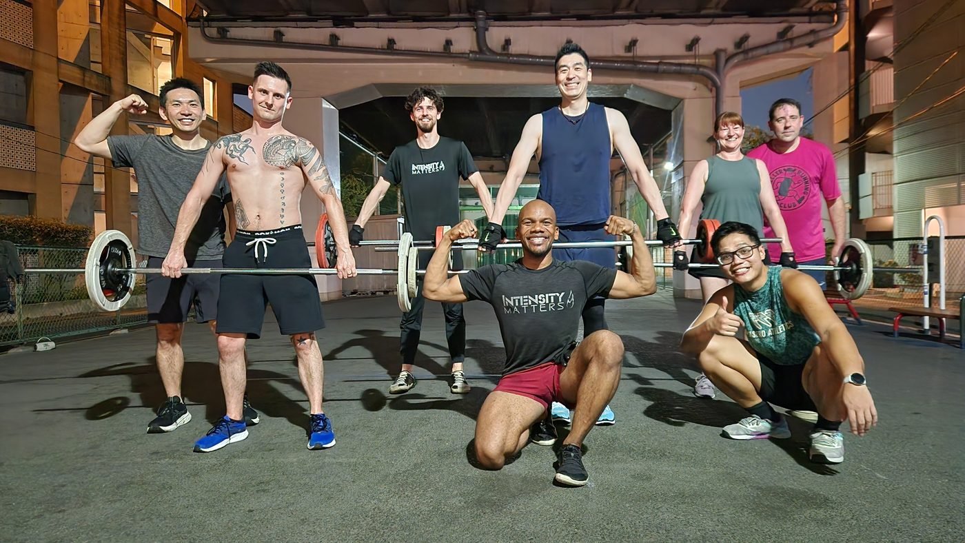Crew with barbells under the expressway