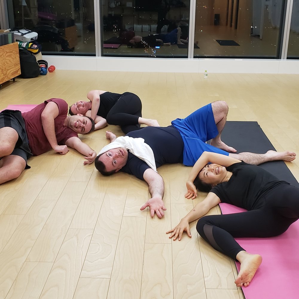 Corporate team stretching in a studio