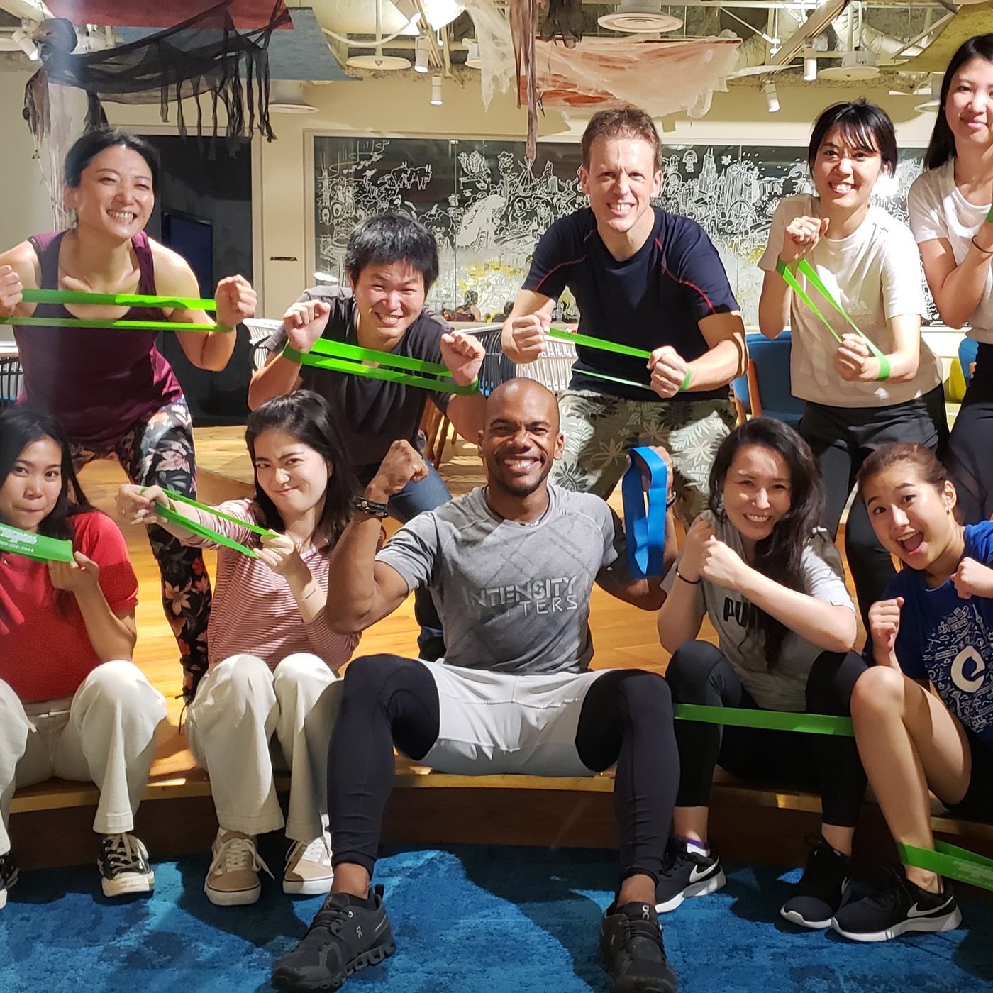 Office team workout with resistance bands